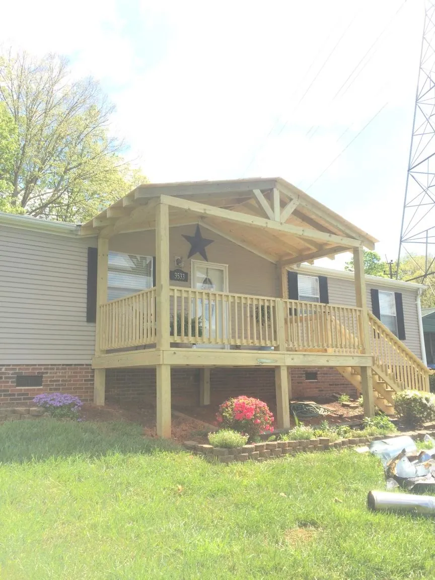 New gabled porch roof and deck railing added to a ranch home in Silver Lake